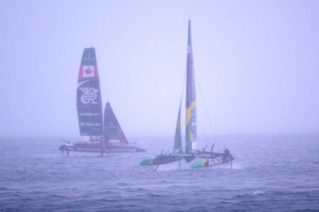 GER, Sail GP, Rockwool Germany Sail Grand Prix, Sassnitz, August 22–23, 2026, Germany, Saturday, August 23, 2026, Race Day 2, BONDS FLYING ROOS Sail GP Team Australia Driver Tom Slingsby, NORTHSTAR Sail GP Team Canada Driver Giles Scott, heavy rain in Sassnitz, GER, Sail GP, Rockwool Germany Sail Grand Prix, Sassnitz, August 22–23, 2026, Germany, Saturday, August 23, 2026, Race Day 2, Copyright: xClaudiusxRauchx