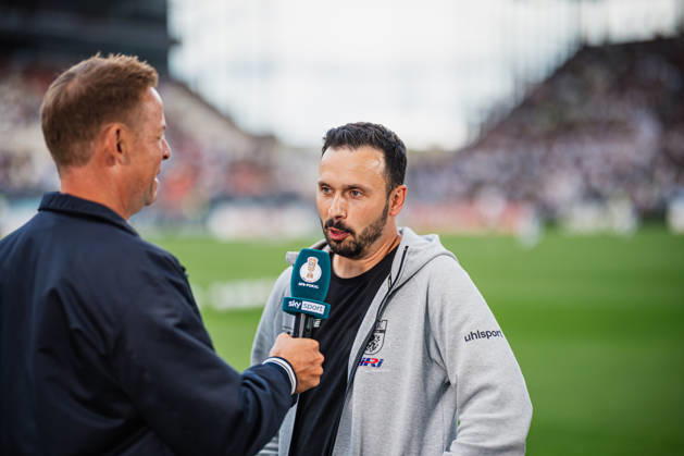 DFB Cup: Lüneburger SK vs. SV Werder Bremen, August 22, 2026; Tarek Gibbah, Lüneburger SK coach, and Hansa warming up; Soccer, DFB Cup, First Round: Lüneburger SK vs. SV Werder Bremen on August 22, 2026, at Millerntor Stadium, Hamburg. DFB regulations prohibit any use of photographs as image sequences and or quasi-video. Copyright: xBEAUTIFULxSPORTS Tonhäuserx