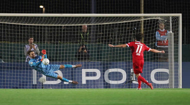 Goalkeeper Luis Zwick makes a save against Fabian Reese in a penalty shootout; game scene; action; sports; soccer; DFB Cup; 1st round; 2026–2027 season; August 24, 2026; VSG Altglienicke vs. VfL Wolfsburg (WOB); DFL regulations prohibit any use of photographs as image sequences and or quasi-video