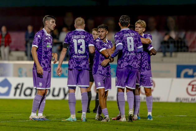 Burghausen, Germany, August 25, 2026—Toto Cup (Bavarian State Cup) 2026–2027, Round of 16: SV Wacker Burghausen vs. FC Ingolstadt 04. Pictured in the crowd is goal scorer E. Mre Gül Guel of FCI celebrating after scoring the 0–4 goal with his teammates at the Flatbuy Stadium in Bavaria Copyright: xFotostandx xSchäferx