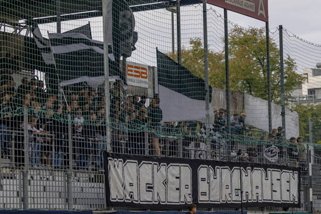 Burghausen, Germany, August 25, 2026 Toto Cup (Bavarian State Cup) 2026–2027 Round of 16: SV Wacker Burghausen vs. FC Ingolstadt 04. Pictured: Wacker Burghausen fans waving flags in the fan section at the flatbuy Stadium in Bavaria. Copyright: xFotostandx xSchäferx