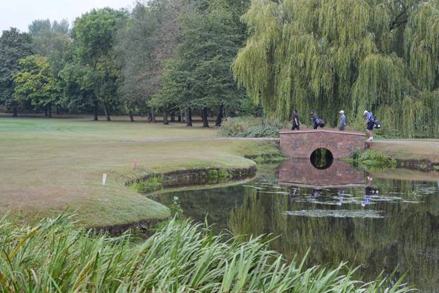 SUTTON COLDFIELD, ENGLAND - AUG 28: Patrick Reed (USA) and Paul Waring (ENG) cross the bridge on the 9th hole during the completion of the delayed Round 1 at the 2026 Husqvarna British Masters at The Belfry, Sutton Coalfield on August 28, 2026 in Warwickshire, England The 2026 Husqvarna British Masters