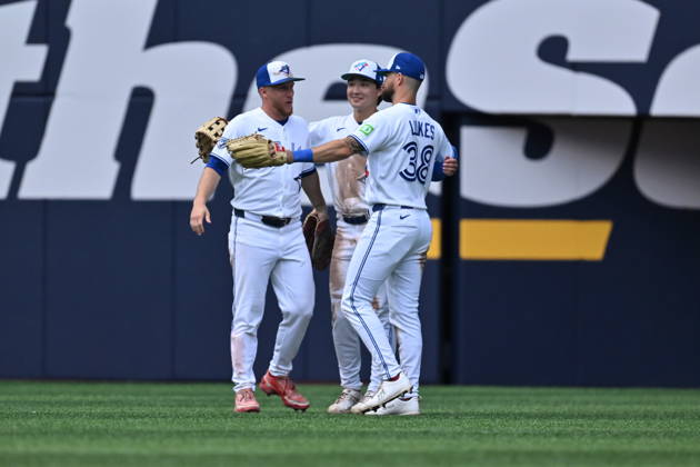August 30, 2026, Toronto, On, Canada: Toronto Blue Jays Myles Straw, left, Brett Bateman, centre and Nathan Lukes celebrate after their team defeated the Seattle Mariners in MLB, Baseball Herren, USA baseball action in Toronto, on Sunday, Aug. 30, 2026. Canada News - August 30, 2026 - ZUMAc35_ 20260830_zaf_c35_063 Copyright: xJonxBlackerx