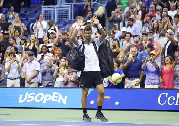 Fans watch Novak Djokovic of Serbia recast as he walks off of the court after his match against Mariano Navone of Argentina in Arthur Ashe Stadium in the first round at the 2026 US Open Tennis Championship at the USTA Billie Jean King National Tennis Center in New York City on Sunday, August 30, 2026. Navone defeated Djokovic in 5 sets.  NYP20260830155 JOHNxANGELILLO