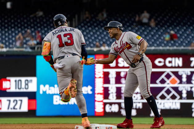 Atlanta Braves right fielder Ronald Acuna Jr. (13) high fives first base coach Antoan Richardson after hitting a home run in the top of the seventh inning during a game against the Washington Nationals at Nationals Park in Washington, DC on Wednesday, September 2, 2026. The Braves beat the Nationals 9-0.  WAP20260902472 BONNIExCASH