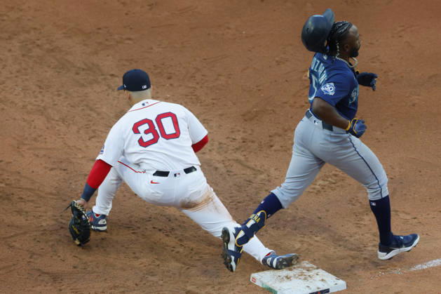 Seattle Mariners Randy Arozarena, right, looses his batting helmet as he is tagged out at first base by Boston Red Sox first baseman Mickey Gasper during the seventh inning at Fenway Park in Boston, Massachusetts on Wednesday, September 2, 2026.  BOP20260902016 CJxGUNTHER