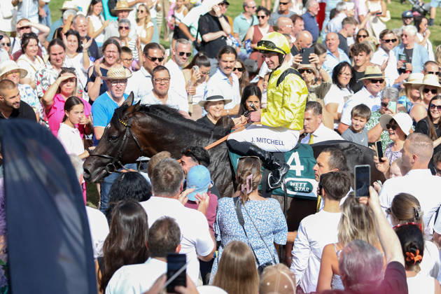 Equestrian sports, horse racing, race day in Iffezheim; Saddadd and jockey Jack Mitchell win the Baden Grand Prix