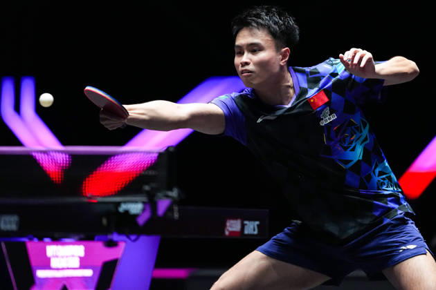 (260911) -- MACAO, Sept. 11, 2026 -- Zhou Qihao hits a return during the men s singles round of 16 match between Zhou Qihao of China and Kanak Jha of the United States at the 2026 World Table tennis, Tischtennis (WTT) Champions Macao in Macao, south China, Sept. 11, 2026. ) (SP)CHINA-MACAO-TABLE TENNIS-WTT-MEN S SINGLES (CN) CheongxKamxKa 