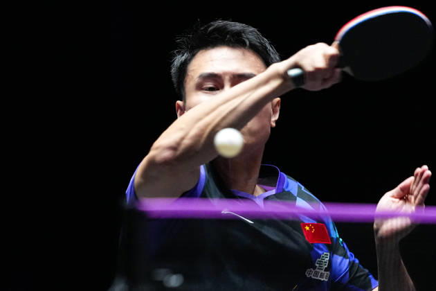 (260911) -- MACAO, Sept. 11, 2026 -- Zhou Qihao hits a return during the men s singles round of 16 match between Zhou Qihao of China and Kanak Jha of the United States at the 2026 World Table tennis, Tischtennis (WTT) Champions Macao in Macao, south China, Sept. 11, 2026. ) (SP)CHINA-MACAO-TABLE TENNIS-WTT-MEN S SINGLES (CN) CheongxKamxKa 
