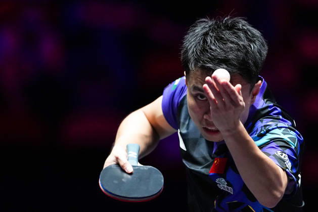 (260911) -- MACAO, Sept. 11, 2026 -- Zhou Qihao serves during the men s singles round of 16 match between Zhou Qihao of China and Kanak Jha of the United States at the 2026 World Table tennis, Tischtennis (WTT) Champions Macao in Macao, south China, Sept. 11, 2026. ) (SP)CHINA-MACAO-TABLE TENNIS-WTT-MEN S SINGLES (CN) CheongxKamxKa 