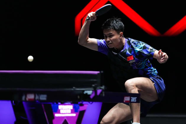 (260911) -- MACAO, Sept. 11, 2026 -- Zhou Qihao hits a return during the men s singles round of 16 match between Zhou Qihao of China and Kanak Jha of the United States at the 2026 World Table tennis, Tischtennis (WTT) Champions Macao in Macao, south China, Sept. 11, 2026. ) (SP)CHINA-MACAO-TABLE TENNIS-WTT-MEN S SINGLES (CN) CheongxKamxKa 
