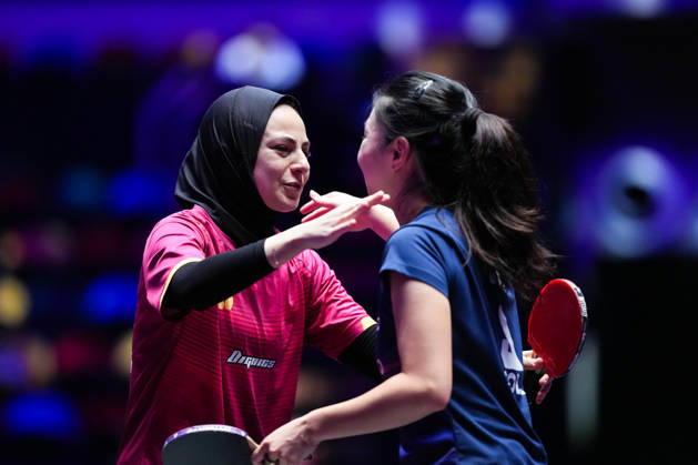 (260911) -- MACAO, Sept. 11, 2026 -- Dina Meshref (L) greets Lili Zhang after the women s singles round of 16 match between Dina Meshref of Egypt and Lili Zhang of the United States at the 2026 World Table tennis, Tischtennis (WTT) Champions Macao in Macao, south China, Sept. 11, 2026. ) (SP)CHINA-MACAO-TABLE TENNIS-WTT-WOMEN S SINGLES (CN) CheongxKamxKa 