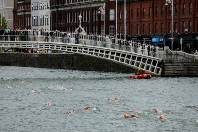 REPRO FREE *PRESS RELEASE NO REPRODUCTION FEE* EDITORIAL USE ONLY 106th Dublin City Liffey Swim 2026, River Liffey, Dublin 12 9 2026 A view of competitors making their way under the Ha penny Bridge A view of competitors making their way under the Ha penny Bridge 12 9 2026  Copyright: xx RB1_7551