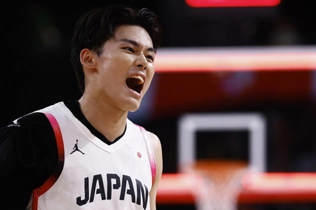 Aichi-Nagoya Asian Games: Basketball Japan s Ren Kanechika shouts following the end of the first quarter of a men s basketball semifinal match against China at the Aichi-Nagoya Asian Games at Aichi International Arena in Nagoya, central Japan, on Sept. 18, 2026.  A14AA0005627839P