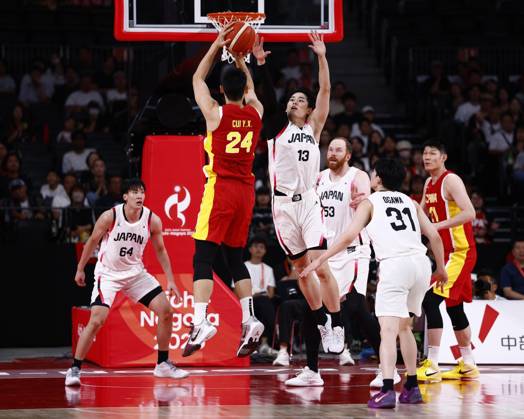 Aichi-Nagoya Asian Games: Basketball Japan s Ren Kanechika (13) blocks China s Cui Yongxi from shooting during the third quarter of a men s basketball semifinal match at the Aichi-Nagoya Asian Games at Aichi International Arena in Nagoya, central Japan, on Sept. 18, 2026.  A14AA0005627854P