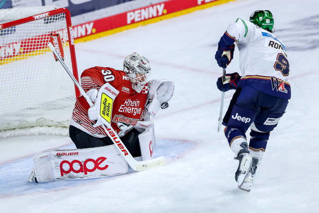 September 25, 2026, Ice Hockey, DEL, Kölner Haie vs. Eisbären Berlin, Matchday 3, 2026–27 Season, Lanxess Arena, Cologne: Goalie Janne Juvonen of the Kölner Haie makes 30 saves in a shootout against Ty Ronning of the Eisbären Berlin 09 in overtime, North Rhine-Westphalia, Germany