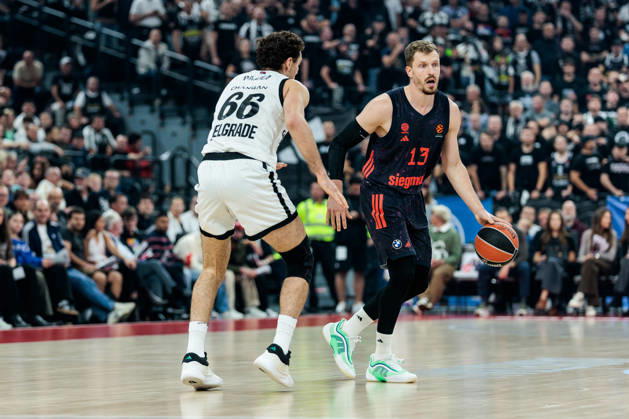 MUNICH, GERMANY - OCTOBER 02: Andreas Andi Obst (FC Bayern Muenchen, 13) controls the ball against Alessandro Pajola (Partizan Mozzart Bet Belgrade, 66) during the Turkish Airlines EuroLeague match between FC Bayern Muenchen vs. Partizan Mozzart Bet Belgrade at SAP Garden on round 3 of Turkish Airlines EuroLeague on October 02, 2026 in Munich, Germany. Bavaria Germany Copyright: xSteffiexWunderlx