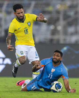 KOLKATA, INDIA - OCTOBER 3: Douglas Luiz Soares de Paulo of Brazil and Rahim Ali of India duel for the ball during friendly match between India and Brazil at the Vivekananda Yuba Bharati Krirangan (VYBK) Stadium in Kolkata, India on 3rd October, 2026 Copyright: xUnnatixNaidux Sportspressphoto_SPR245241