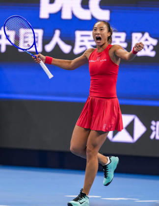 (261007) -- BEIJING, Oct. 7, 2026 -- Zheng Qinwen of China celebrates after winning the women s singles fourth round match between Zheng Qinwen of China and Alina Charaeva of Armenia at 2026 China Open tennis tournament in Beijing, China, Oct. 7, 2026. ) (SP)CHINA-BEIJING-TENNIS-CHINA OPEN-WOMEN S SINGLES (CN) SunxFei