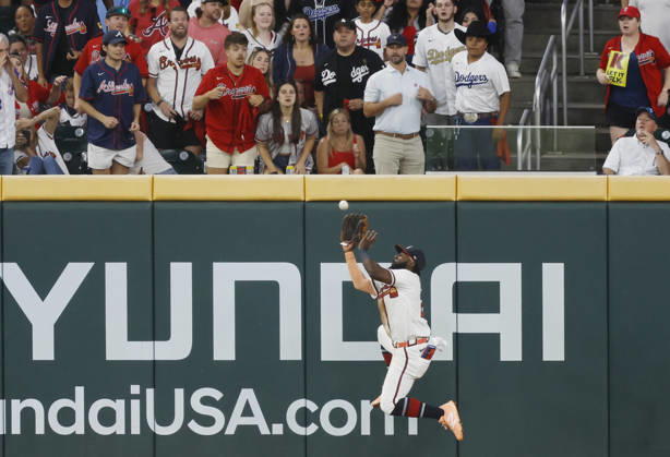 Atlanta Braves center fielder Michael Harris II (23) makes a catch against the Los Angeles Dodgers in the fifth inning in an MLB, Baseball Herren, USA National League Division Series playoff game at Truist Park in Atlanta, Georgia, on Wednesday, October 7, 2026.  ATL20261007720 MIKExZARRILLI