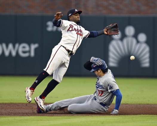 Baseball: Division Series between Dodgers and Braves Los Angeles Dodgers designated hitter Shohei Ohtani (R) steals second base as Atlanta Braves second baseman Ozzie Albies fails to gather the ball during the second inning of Game 4 of the National League Division Series at Truist Park in Atlanta on Oct. 7, 2026.  A14AA0005630401P