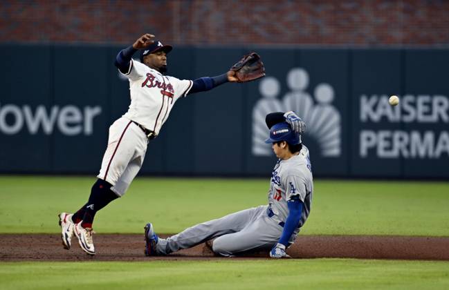 Baseball: Division Series between Dodgers and Braves Los Angeles Dodgers designated hitter Shohei Ohtani (R) steals second base as Atlanta Braves second baseman Ozzie Albies fails to gather the ball during the second inning of Game 4 of the National League Division Series at Truist Park in Atlanta on Oct. 7, 2026.  A14AA0005630402P
