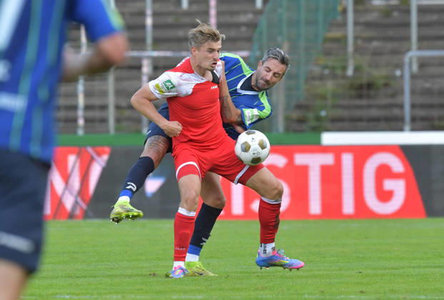October 10, 2026, GER, Soccer, Regionalliga West, 2026–2027 Season, Matchday 12, Ohlendorf Stadium in Heidewald, Gütersloh FC vs. SF Siegen 0–5, Kevin Hingerl (FC Gütersloh, right) vs. Elias Paul Huth (SF Siegen), action, duel, tackle