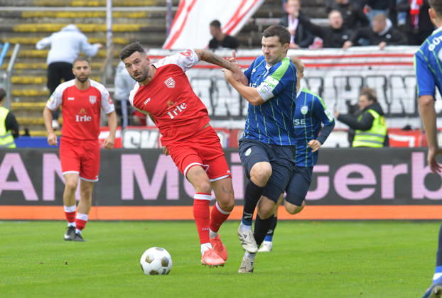 October 10, 2026, GER, Soccer, Regionalliga West, 2026–2027 Season, Matchday 12, Ohlendorf Stadium in Heidewald, Gütersloh FC vs. SF Siegen 0–5, Björn Rother (FC Gütersloh, right) vs. Dennis Brock (SF Siegen), action, duel, tackle