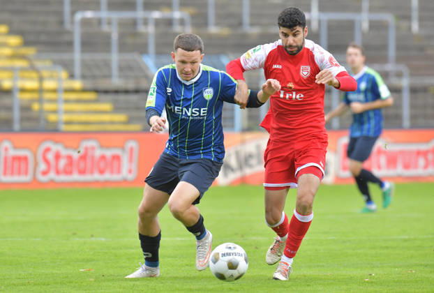 October 10, 2026, Germany, Soccer, Regionalliga West, 2026–2027 Season, Matchday 12, Ohlendorf Stadium in Heidewald, Gütersloh FC vs. SF Siegen 0–5, Phil Beckhoff (FC Gütersloh, left) vs. Hamza Saghiri (SF Siegen), action, duel, tackle