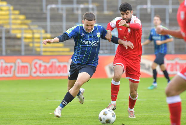 October 10, 2026, Germany, Soccer, Regionalliga West, 2026–2027 Season, Matchday 12, Ohlendorf Stadium in Heidewald, Gütersloh FC vs. SF Siegen 0–5, Phil Beckhoff (FC Gütersloh, left) vs. Hamza Saghiri (SF Siegen), action, duel, tackle