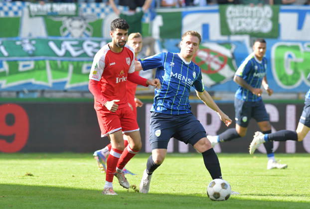 October 10, 2026, GER, Soccer, Regionalliga West, 2026–2027 Season, Matchday 12, Ohlendorf Stadium in Heidewald, Gütersloh FC vs. SF Siegen 0–5. Jan Lukas Liehr (FC Gütersloh), on the right, against Hamza Saghiri (SF Siegen); action, duel, tackle