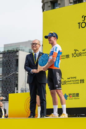 Tour De Kyushu Stage Finishes In Fukuoka s Tenjin For The First Time Matteo Malucelli of XDS Astana Team wins Stage 1 of the Mynavi Tour de Kyushu 2026 at the finish line on Tenjin Bridge in Fukuoka, Japan, on October 10, 2026. The Italian won the 152.0-kilometer Saga-Fukuoka stage in 3 hours 9 minutes 51 seconds, ahead of Luke Mudgway (Li Ning Star) and Alessio Delle Vedove (XDS Astana Team), and took the general and points classification leads. It was the first time the race finished in Tenjin, the commercial heart of Fukuoka, where a parade, stage events and food stalls marked the day. The race, first held in 2023 and part of the UCI Asia Tour (2.1 category), runs October 9-12 through six Kyushu prefectures under the official title We stand with Kumamoto. Mynavi Tour de Kyushu 2026, adopted to support areas affected by the Kumamoto earthquake. Fukuoka Japan  Copyright: xRyoxChix originalFilename:zhi-tourdeky261010_npGhA.jpg