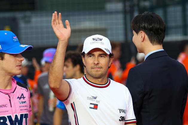 2026 Formula 1 Singapore Grand Prix SINGAPORE - OCTOBER 11: Cadillac driver Sergio Perez waves during the Drivers Parade at the Formula One Grand Prix of Singapore, at the Marina Bay Street Circuit in Singapore, on October 11, 2026. The upcoming main race will span 62 laps, with drivers competing in intense tropical heat and extreme humidity on a track featuring a relentless layout of 19 corners and minimal straightaways. Daniel Ceng Anadolu Singapore Singapore. Editorial use only. Please get in touch for any other usage.  Copyright: x2026xAnadoluxDanielxCengx