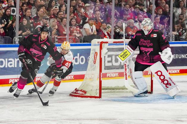 Ice Hockey: Penny DEL, Matchday 8—Cologne Sharks vs. Nuremberg Ice Tigers on October 11, 2026, at the Lanxess Arena in Cologne. Louis Marc Aubry (Cologne), left: Thomas Heigl (Nuremberg), center: Janne Juvonen (Cologne), right: In accordance with the regulations of the DEL (German Ice Hockey League), the publication and further use of the footage in electronic media and on devices of any kind during the game is not permitted. xDMx