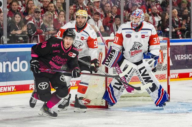 Ice Hockey: Penny DEL, Matchday 8—Cologne Sharks vs. Nuremberg Ice Tigers on October 11, 2026, at the Lanxess Arena in Cologne. Gregor MacLeod (Cologne), left: Constantin Braun (Nuremberg), center: Niklas Treutle (Nuremberg), right: In accordance with the guidelines of the DEL (German Ice Hockey League), the publication and further use of the images in electronic media and on devices of any kind during the game is not permitted xDMx