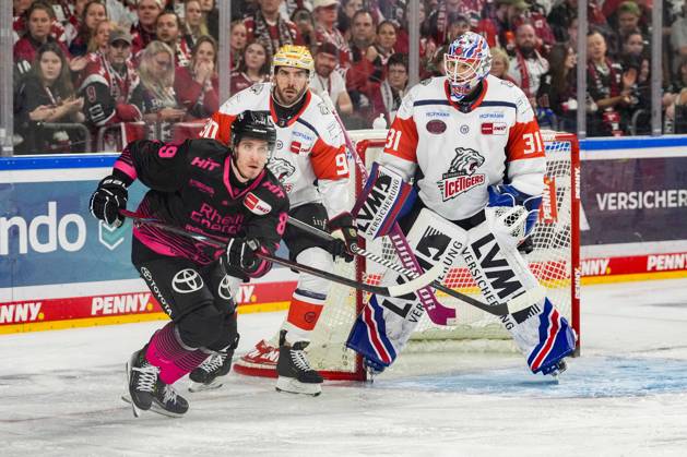 Ice Hockey: Penny DEL, Matchday 8—Cologne Sharks vs. Nuremberg Ice Tigers on October 11, 2026, at the Lanxess Arena in Cologne. Gregor MacLeod (Cologne), left: Constantin Braun (Nuremberg), center: Niklas Treutle (Nuremberg), right: In accordance with the guidelines of the DEL (German Ice Hockey League), the publication and further use of the images in electronic media and on devices of any kind during the game is not permitted xDMx