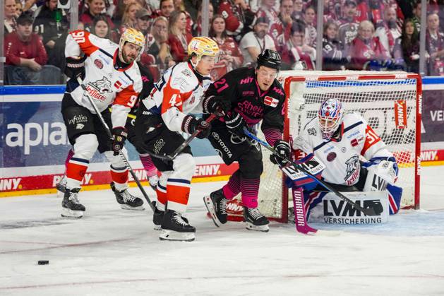 Ice Hockey: Penny DEL, Matchday 8—Cologne Sharks vs. Nuremberg Ice Tigers on October 11, 2026, at the Lanxess Arena in Cologne. From left to right: Constantin Braun (Nuremberg), Owen Headrick (Nuremberg), Juhani Tyrväinen (Cologne), Niklas Treutle (Nuremberg). In accordance with the regulations of the DEL (German Ice Hockey League), the publication and further use of these images in electronic media and on devices of any kind during the game is not permitted. xDMx