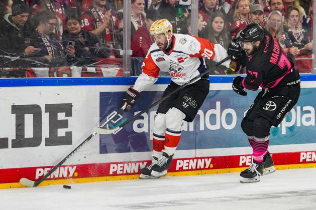 Ice Hockey: Penny DEL, Matchday 8—Cologne Sharks vs. Nuremberg Ice Tigers on October 11, 2026, at the Lanxess Arena in Cologne. Constantin Braun (Nuremberg), left: Ryan Macinnis (Cologne), right: In accordance with the regulations of the DEL (German Ice Hockey League), the publication and further use of the footage in electronic media and on devices of any kind during the game is not permitted xDMx