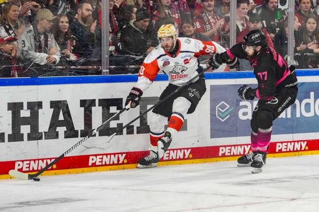 Ice Hockey: Penny DEL, Matchday 8—Cologne Sharks vs. Nuremberg Ice Tigers on October 11, 2026, at the Lanxess Arena in Cologne. Constantin Braun (Nuremberg), left: Ryan Macinnis (Cologne), right: In accordance with the regulations of the DEL (German Ice Hockey League), the publication and further use of the footage in electronic media and on devices of any kind during the game is not permitted xDMx