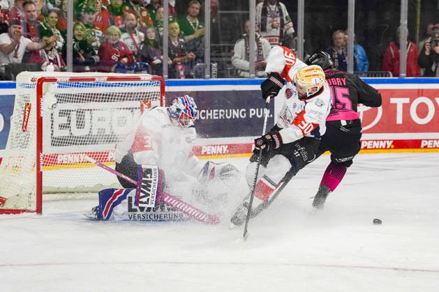Ice Hockey: Penny DEL, Matchday 8—Cologne Sharks vs. Nuremberg Ice Tigers on October 11, 2026, at the Lanxess Arena in Cologne. Niklas Treutle (Nuremberg), left: Constantin Braun (Nuremberg), center: Louis Marc Aubry (Cologne), right: In accordance with the regulations of the DEL (German Ice Hockey League), the publication and further use of the images in electronic media and on devices of any kind during the game is not permitted xDMx