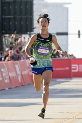 Akira Akasaki of Japan crosses the finish line with a time of 02:05:47 placing 9th over all during 2026 Bank of America Chicago Marathon in Chicago on Sunday, Oct. 11, 2026.  CHI20261011102 MARKxBLACK