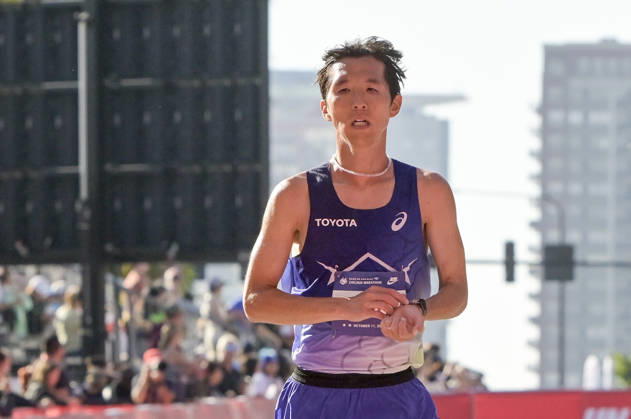 Tomoki Ota of Japan crosses the finish line with a time of 02:11:52 placing 26th over all placing during 2026 Bank of America Chicago Marathon in Chicago on Sunday, Oct. 11, 2026. CHI20261011112 MARKxBLACK