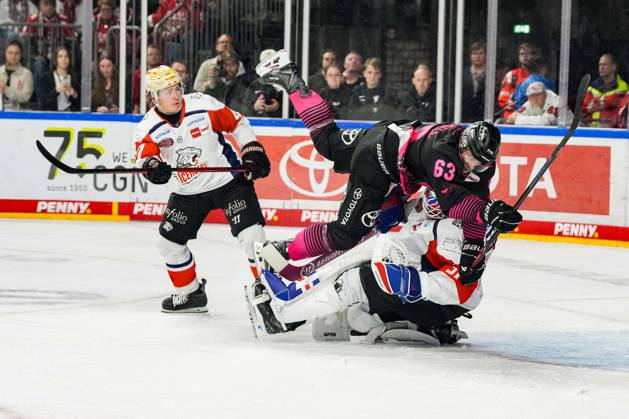 Ice Hockey: Penny DEL, Matchday 8—Cologne Sharks vs. Nuremberg Ice Tigers on October 11, 2026, at the Lanxess Arena in Cologne. Patrick Russell (Cologne), center, collides with Nuremberg goalie Niklas Treutle. According to the regulations of the DEL (German Ice Hockey League), the publication and further use of the footage in electronic media and on devices of any kind during the game is not permitted. xDMx