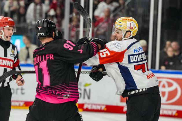 Ice Hockey: Penny DEL, Matchday 8—Cologne Sharks vs. Nuremberg Ice Tigers on October 11, 2026, at the Lanxess Arena in Cologne. Things got rough once again at the end of the final period. Here with Moritz Müller of Cologne, on the left, and Samuel Dove McFall of Nuremberg. According to the regulations of the DEL (German Ice Hockey League), the publication and reuse of the footage in electronic media and on devices of any kind during the game is not permitted. xDMx