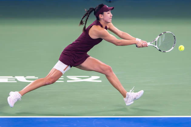 (261012) -- WUHAN, Oct. 12, 2026 -- Wang Xinyu hits a return during the women s sinlges round of 64 match between Wang Xiyu of China and Wang Xinyu of China of the 2026 Wuhan Open tennis tournament in Wuhan, capital of central China s Hubei Province, Oct. 12, 2026. ) (SP)CHINA-WUHAN-TENNIS-WUHAN OPEN-WOMEN S SINGLES-ROUND OF 64 (CN) DuxZixuan