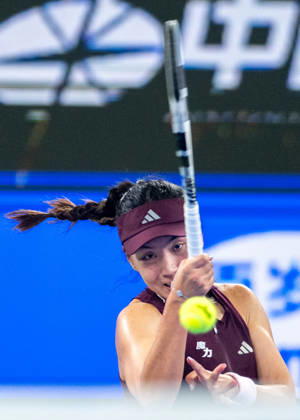 (261012) -- WUHAN, Oct. 12, 2026 -- Wang Xinyu hits a return during the women s sinlges round of 64 match between Wang Xiyu of China and Wang Xinyu of China of the 2026 Wuhan Open tennis tournament in Wuhan, capital of central China s Hubei Province, Oct. 12, 2026. ) (SP)CHINA-WUHAN-TENNIS-WUHAN OPEN-WOMEN S SINGLES-ROUND OF 64 (CN) DuxZixuan