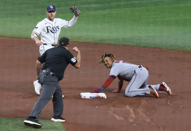 Cleveland Guardians Jose Ramirez (11) is caught stealing second by Tampa Bay Rays shortstop Taylor Walls (6) in the first inning in game one of the MLB, Baseball Herren, USA American League Championship Series playoff at Raymond James Stadium in Tampa, Florida, on Monday, October 12, 2026.  TPB20261012703 GARYxBOGDON