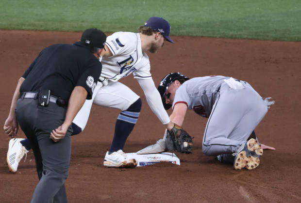 Cleveland Guardians Travis Bazzana (37) safely steals second past the tag of Tampa Bay Rays shortstop Taylor Walls (6) in the fourth inning in game one of the MLB, Baseball Herren, USA American League Championship Series playoff at Raymond James Stadium in Tampa, Florida, on Monday, October 12, 2026.  TPB20261012710 GARYxBOGDON