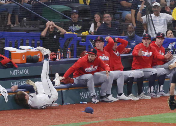 Tampa Bay Rays left fielder Jonny DeLuca (21) falls after colliding with Junior Caminero chasing a long fly ball from Cleveland Guardians Steven Kwan in the ninth inning in game one of the MLB, Baseball Herren, USA American League Championship Series playoff at Raymond James Stadium in Tampa, Florida, on Monday, October 12, 2026.  TPB20261012716 GARYxBOGDON
