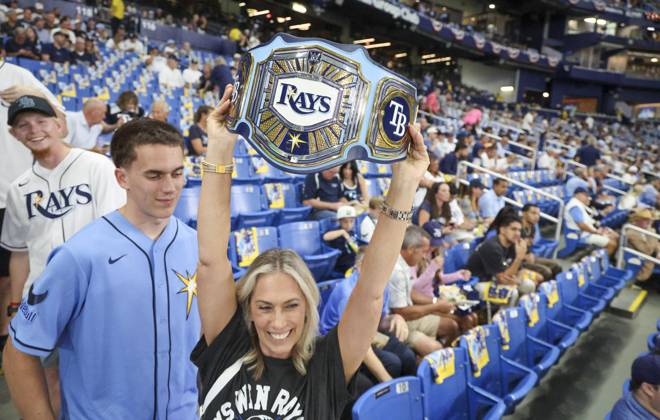 October 12, 2026, St. Petersburg, Florida, USA: Kristy Derosa, of Sarasota, displays Tampa Bay Rays MMA belt before the start of Game 1 of the American League Championship Series between the Tampa Bay Rays and the gainst the Cleveland Guardians on Monday, Oct. 12, 2026, at Tropicana Field in St. Petersburg. St. Petersburg USA - ZUMAs70_ 0869261386st Copyright: xDouglasxR.xCliffordx